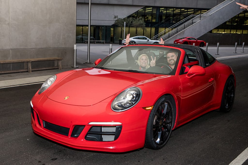 fiserv_pec event_.karen images 2019 - 795 - atlanta's commercial photographer an image of people in a red 911 at a corporate event at one porsche drive photographed by corporate event photographer karen images