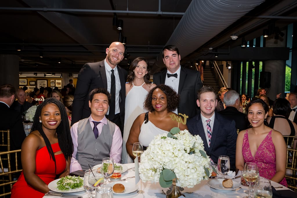 porsche corporate event 06 - atlanta's commercial photographer an image of people at a table at a corporate event at one porsche drive photographed by corporate event photographer karen images