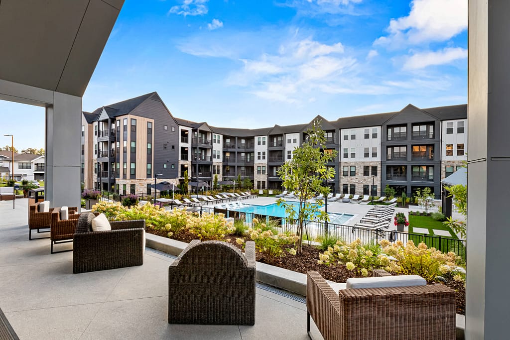 13 - oslo_mcshane construction_karen images 2024 -_ - atlanta's commercial photographer a front porch overlooking the pool at oslo by architectural photographer karen images