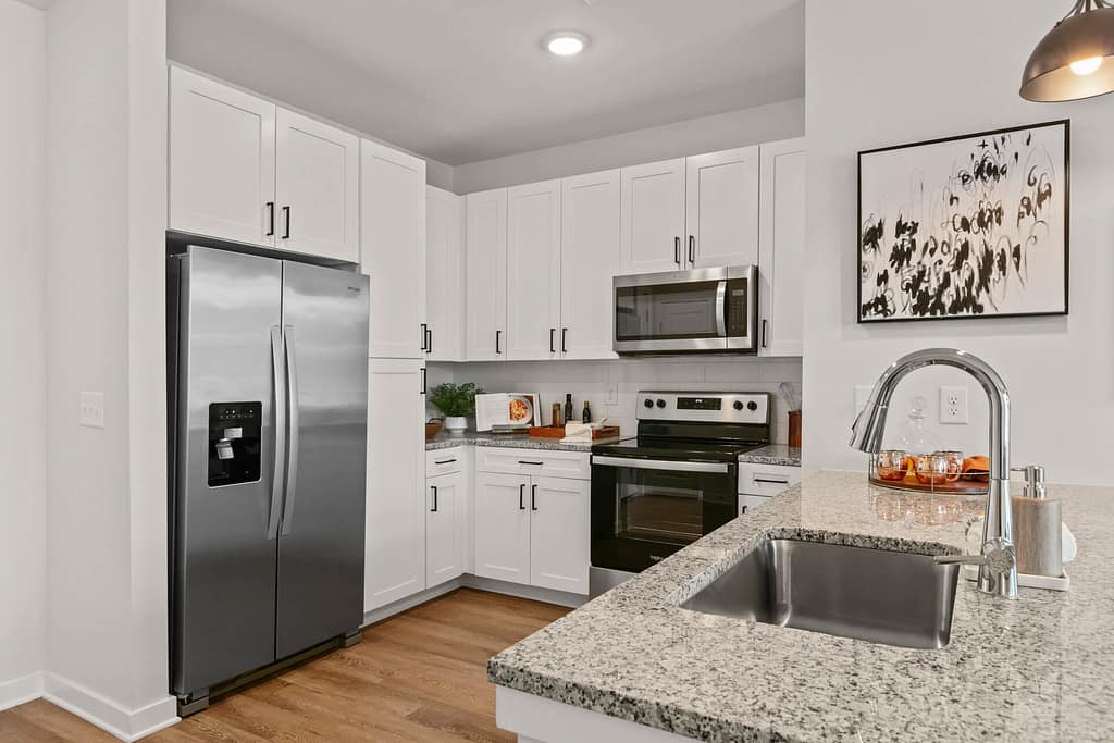 39 crofthouse_one bedroom_kitchen 2_karen images_2024 - 02 copy - atlanta's commercial photographer alternate view of kitchen in a one bedroom model home at crofthouse photographed by architectural photographer karen images