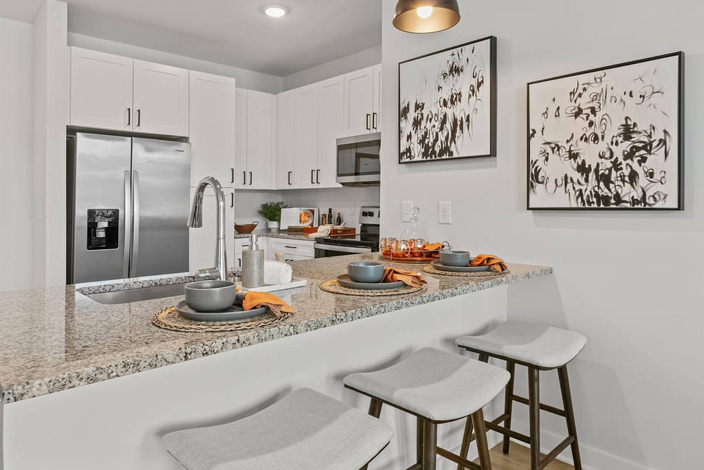 40 crofthouse_one bedroom_kitchen 3_karen images_2024 - 02 copy - atlanta's commercial photographer breakfast bar in a kitchen in a one bedroom model home at crofthouse photographed by architectural photographer karen images