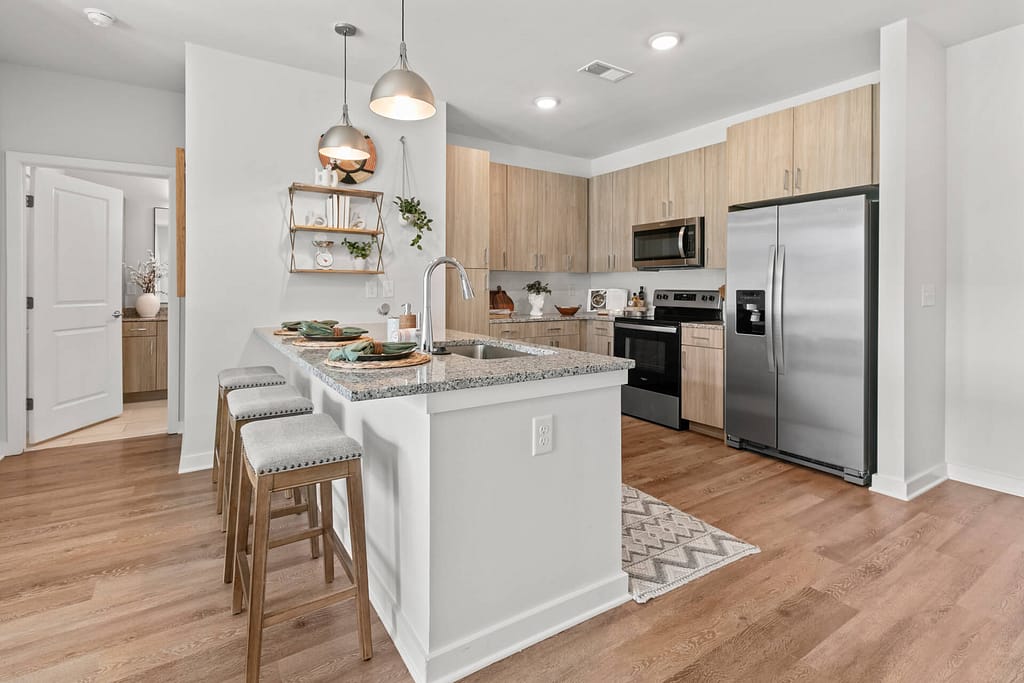 49 crofthouse_two bedroom_kitchen 1_karen images_2024 - 02 copy - atlanta's commercial photographer a breakfast bar in a two bedroom apartment at crofthouse photographed by a kitchen in a one bedroom model home at crofthouse photographed by architectural photographer karen images