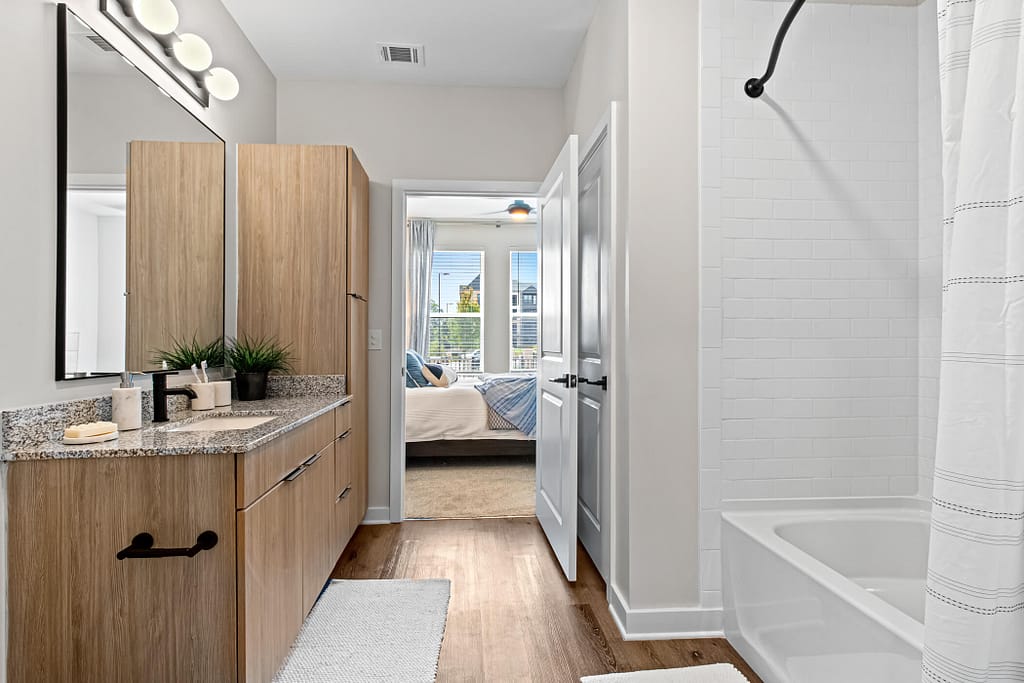 54 - oslo_one bedroom_mcshane construction_karen images 2024 -_ - atlanta's commercial photographer alternate view of a bathroom in a one bedroom model home in atlanta