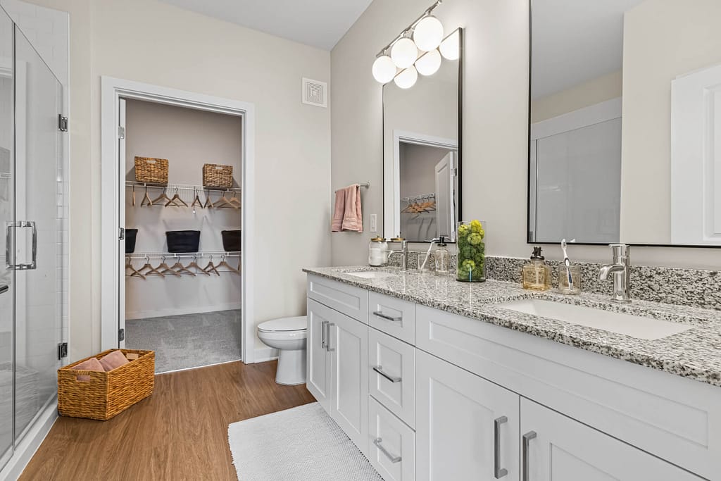 62 - oslo_two bedroom_mcshane construction_karen images 2024 -_ - atlanta's commercial photographer bathroom cabinets and closet in a two bedroom model home in oslo by architectural photographer karen images