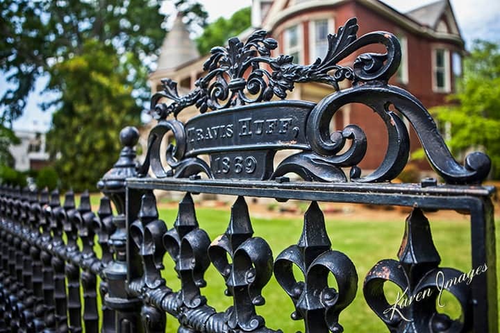 travis huff gate - atlanta's commercial photographer a color image of fine art photography of an iron fence in front of a victorian mansion in college park, georgia photographed by atlanta fine art photographer karen images