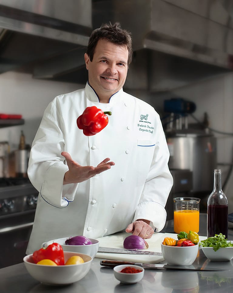 corporate marketing_advertising_commercial_ads_karen images 2023 - 037 - atlanta's commercial photographer image of an executive chef catching a red pepper in a test kitchen in atlanta, ga by commercial photographer karen images